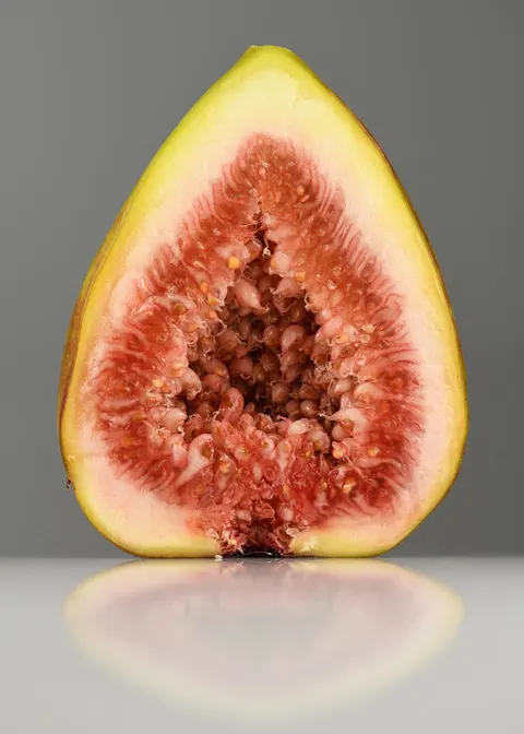 Cut fig showing the interior fruit color.